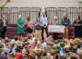 OES 1st Grade teacher Megan VandeVoort talks after receiving the 'Golden Apple Award'.
