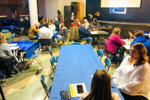Participants get ready for World Food Celebration at the Oskaloosa Art Center.