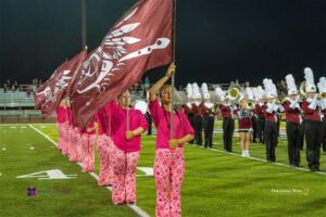 The Oskaloosa High School Marching Band during a home football performance in 2023.