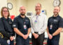 Mahaska Health Emergency Services Medical Director Matthew Gritters, MD (white shirt) with emergency room staff. (Mahaska Health Photo)