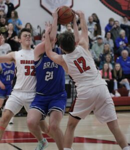 RD Keep/NM Communications Photo

Montezuma’s Max Anderson (23) finds a tough defense from North Mahaska’s Jack Kelderman (32) and Asher DeBoef. Anderson scored 18 points to help Monte to an 80-60 win. 
