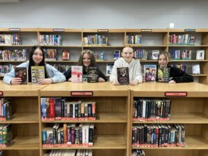 Oskaloosa Middle School students receiving the books donated by Book Vault.