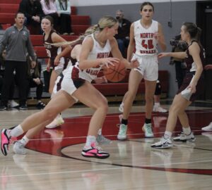 RD Keep/North Mahaska Communications Photo North Mahaska’s Breckyn Schilling makes a drive down the lane in the first half of the No. 7 Warhawks’ game with Grundy Center. Schilling poured in 24 points to help NM to a 53-46 victory.