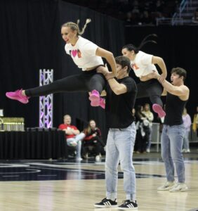 Photo by RD Keep/NM Communications
Breckyn Schilling and Lily Hartwig are raised high above the heads of Nate Sampson and Austin McMahan during their co-ed routine at Wells Fargo.