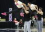 Photo by RD Keep/NM Communications Breckyn Schilling and Lily Hartwig are raised high above the heads of Nate Sampson and Austin McMahan during their co-ed routine at Wells Fargo.