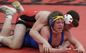 RD Keep/North Mahaska Communications

North Mahaska senior Austin McMahan controls Wapello’s Carter Bell en route to an 11-5 win on senior night. North Mahaska defeated Wapello 50-16. 