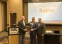 Iowa Secretary of Agriculture Mike Naig (left) presents the Secretary's Renewable Fuels Marketing Award for Ethanol to Joel Allen (middle) and Joe Weber (right), both of Hy-Vee. The presentation occurred at the 2024 FUELIowa legislative conference in Des Moines on January 9, 2024. Due to inclement weather, a representative from Reif Oil Company was unable to attend the meeting to accept the Secretary's Renewable Fuels Marketing Award for Biodiesel.