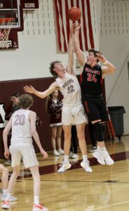 RD Keep/NM CommunicationsNorth Mahaska’s Nolan Andersen (24) battle Oskaloosa’s Gus Bunnell on a shot. Andersen scored 24 points to lead NM to a 56-53 win while Bunnell scored a double-double with 13 points and 10 rebounds.