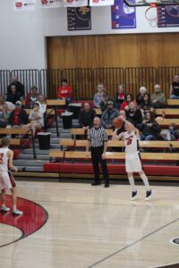 RD Keep/NM Communications Gabe Hora of North Mahaska spots up for a first half 3-pointer. North Mahaska hit 15 long balls en route to an 83-38 win over Martensdale-St. Marys.