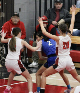 RD Keep/NM Communications

Columbus Community’s Arianna Vergara was smothered by North Mahaska defenders Aly Steil, left, and Kayla Readshaw (20). Vergara was held to eight points as No. 14 North Mahaska moved to the Class 1A regional final with a 61-22 win. 
