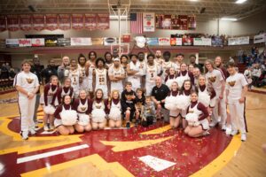 Ottumwa, IA – For the 19th time in program history, the Indian Hills Men's Basketball team punched its ticket to the National Junior College Athletic Association (NJCAA) DI Men's Basketball National Tournament after winning the 2024 NJCAA North Central District Championship Saturday night. The Warriors defeated No. 20 North Dakota State College of Science 90-74 at the Hellyer Center.
The Warriors claimed their 17th all-time NJCAA District Championship after running past the Wildcats with a dominant showing on the hardwood Saturday night, the team's 11th consecutive victory heading into the national tournament. The Warriors advance to the national tournament for the third consecutive year and ninth time in the last 10 seasons.
Indian Hills will learn its national tournament seed and opponent Sunday night via the NJCAA Selection Show via the NJCAA Network at 6:00 PM Sunday night. Warrior fans are invited to join head coach Josh Sash and the team at the Hellyer Center as the team awaits its seed in Hutchinson, KS.
The Warriors were led by sophomore guard TJ Morris (Queens, NY/Northeastern Oklahoma A&M) on Saturday with 19 points, including a perfect 7-7 at the free throw line. Morris was joined in double-figures by Chris Mpaka (Kinsasha, Congo/Frank Phillips) who posted 14 points and six rebounds to go along with four blocks. Braden Sparks (Villa Rica, GA/Mercer) tacked on 11 points while Davontae Hall (Chicago, IL/Hyde Park) and Trevion LaBeaux (Waterloo, IA/Ames) added 10 apiece.
LaBeaux made his return to the hardwood Saturday night after missing the previous three contests due to an injury. The sophomore sparked the team on both ends of the court and grabbed a team-high eight rebounds for the Warriors.
Indian Hills handed the Wildcats just their second defeat of the season as the No. 20 nationally ranked program fell to 31-2 on the year. The 90 points scored by the Warriors were the most allowed by NDSCS, a team that ranked third in the nation with 62.5 points per game allowed. Indian Hills connected on 49.2 percent of its shots, including 50.0 percent (9-18) from three-point range. As a team, the Warriors went 23-27 at the charity stripe, the team's third consecutive game shooting at least 84 percent from the line while making at least 16 free throws.
The Warriors controlled the opening tip on Saturday night and never looked back. Playing in front of its home crowd for the sixth consecutive contest, the Warriors never trailed in the opening half and built its lead to double-digits late in the first frame as Morris tallied 11 points through the first 20 minutes of action.
The Wildcats clawed back to within eight on multiple occasions throughout the early goings of the second half, but it was all Indian Hills down the stretch as the home team carried out its 11th consecutive win. The Warriors shot 53.8 percent from the floor in the second half alone and went 16-18 from the stripe over the final 20 minutes.
Sparks facilitated the Warrior offense with a game-high six assists while grabbing a season-high seven boards for the Warriors.
One of the most historic programs in junior college basketball, the Warriors will make the trek to Hutchinson, KS as one of 16 automatic qualifiers with the District title. The 24-team field gets underway Sunday, March 24 from the Hutchinson Sports Arena, a court where the Warriors have captured three national championships and 29 victories all-time.