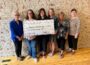 Members of Mahaska County Community Foundation present a $5000 grant award to Friends of Stilwell Public Library of New Sharon. Pictured from left to right are Margaret Ratcliffe, Christy Bellinger, Alexa Stout, Josie Davis, Vicky Collette, and Madonna Bowie.