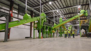 REGEN Fiber is using a conveyor system to process wind turbine blades into small bits that can be incorporated into concrete and asphalt. (Photo courtesy of REGEN Fiber)