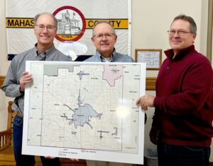 Chris Hyland, Musco VP CFO, Frank Hansen, MCG Director of Business Development, and Mark Groenendyk, County Supervisor, are showing the Fiber Construction Build Map for Mahaska County. This map is on display at the Oskaloosa MCG Office or on the website https://www.mahaska.org/rural-mahaska-fiber. If you visit this website link, you will find the Mahaska County build map. There is an option for you to type in your address to find out the tentative timeline for when MCG's fiber construction will be complete in your area.