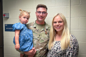 Staff Sergeant Nicolas M. Darland of the Iowa National Guard, with his family at a recent awards ceremony.