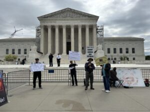 Protesters outside the U.S. Supreme Court on April 25, 2024, during oral arguments on a presidential immunity case. (Photo by Jane Norman/States Newsroom)