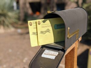  Absentee ballots in a mailbox. (Photo by Jim Small/Arizona Mirror)
