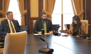  Reps. John Wills, left, Derek Wulf and Elizabeth Wilson considered legislation March 19, 2025 that would impose a three-year moratorium on Iowa Economic Development Authority programs and funding for Iowa’s four most populous counties. (Photo by Robin Opsahl/Iowa Capital Dispatch)