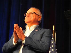  Minnesota Gov. Tim Walz held a town hall event at Roosevelt High School in Des Moines March 14, 2025, answering questions and hearing from Iowans who expressed their problems with cuts made by the Trump administration. (Photo by Robin Opsahl/Iowa Capital Dispatch)