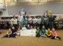 Students and staff at Oskaloosa Elementary School celebrate a $10,000 donation from Cargill Cares – Eddyville, presented to the Oskaloosa Elementary School library to support the school's nonfiction book collection. Representatives from Cargill Cares join teachers and students in displaying the check, which will help provide updated, high-quality non-fiction resources for young learners.