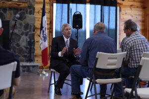  Former Iowa Governor and U.S. Secretary of Agriculture Tom Vilsack chats with Iowa farmers in Warren County on April 29, 2025. (Photo by Cami Koons/Iowa Capital Dispatch) 
