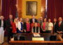 Gov. Kim Reynolds was joined by Iowa Secretary of State Paul Pate, legislators and county auditors in her office June 2, 2025 as she signed into law two bills from the 2025 legislative session related to Iowa elections. (Photo courtesy the Iowa Secretary of State’s office)