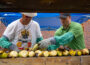 Volunteers roast some of the approximately 1800 ears of corn available at Thursday nights 'Sweet Corn Serenade'.