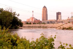  The Raccoon River weaves past downtown Des Moines, Iowa, in June. One of the primary drinking water sources for the region, the river has high nitrate levels that have led to water restrictions for some 600,000 customers. (Photo by Cami Koons/Iowa Capital Dispatch)