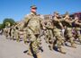 Iowa National Guard members will be deployed to assist federal immigrant enforcement efforts, Gov. Kim Reynolds announced Aug. 12, 2025. Guard members are shown here marching in a parade at the Iowa State Fair. (Photo courtesy of Iowa National Guard)