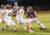 Oskaloosa quarterback Tyler Edgar scrambles from Mt. Pleasant defenders on Friday night.