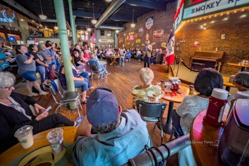 Rob Sand, Iowa’s State Auditor and Democratic candidate for governor, speaks to a crowd at Smokey Row in Oskaloosa during his “100 Town Hall Tour.” Sand outlined his campaign themes of accountability, school funding, and political reform as part of his bid for the 2026 open governor’s race.