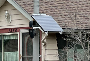 Typical Flock ALPR, mounted to a pole and powered by a solar panel