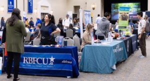  Recruiters discuss jobs with students at a July 2024 jobs fair at St. Edward’s University in Austin, Texas. A new jobs report shows jobs nationwide rebounded after October losses, with a 64,000 gain in November. (Photo courtesy of St. Edward’s University)