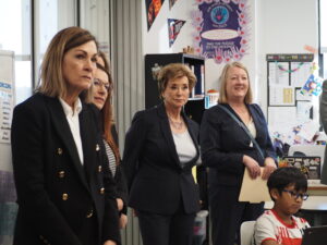  Gov. Kim Reynolds, left, and U.S. Education Secretary Linda McMahon, center, as well as Denison Community School District Superintendent Kim Buryanek, right, listened in on a class at Broadway Elementary School in Denison Jan. 7, 2026. (Photo by Robin Opsahl/Iowa Capital Dispatch)