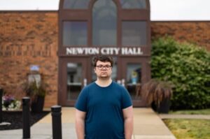 Noah Petersen in front of Newton City Hall. (Photo courtesy of the Institute for Justice)