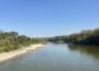 A family swims in the Raccoon River where it flows through Walnut Woods State Park in West Des Moines in October 2025. (Photo by Cami Koons/Iowa Capital Dispatch)