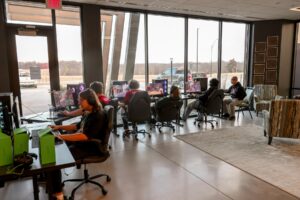 Oskaloosa High School students participate in live eSports competition during the program’s first home meet, with community members in attendance to cheer them on. 