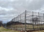 Barbed wire and fences surround the Charles H. Hickey Jr. School, a juvenile detention center in Maryland. Juvenile justice is one of the focuses of criminal justice legislation nationwide this year, including in Maryland, where lawmakers are considering a bill that would reduce the number of juveniles charged as adults. (Photo by Amanda Watford/Stateline)