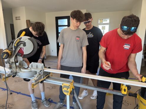 Oskaloosa High School students in the Building Trades program work on building this year’s student-built home in the Fox Run neighborhood. The hands-on class gives students real-world construction experience as they build a full-scale house from the ground up.