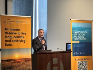  Harkin Institute Wellness and Nutrition Policy Director Adam Shriver speaks during a press conference March 25, 2026, about a report released by the institute and the Iowa Environmental Council on Iowa’s cancer rates and risks. (Photo by Brooklyn Draisey/Iowa Capital Dispatch)