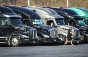 Tractor trailers sit parked in a row at a truck stop in Bloomsbury, N.J. (Dana DiFilippo/New Jersey Monitor)