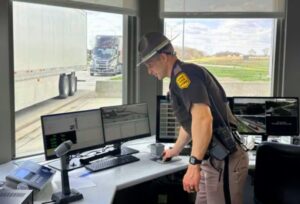  An Iowa State Patrol employee at one of Iowa’s interstate weigh stations for commercial vehicles. (Photo courtesy Iowa Department of Public Safety)