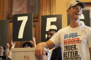  Iowa Auditor Rob Sand and his gubernatorial campaign staff brought multiple boxes containing binders of petition signatures to the Iowa Secretary of State’s office March 9, 2026, submitting paperwork qualifying his Iowa gubernatorial campaign for the 2026 ballot. (Photo by Robin Opsahl/Iowa Capital Dispatch)