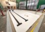Crews work through the final phase of construction inside the Mahaska County YMCA’s new pool facility, where detailed finish work, mechanical systems, and splash pad features are being installed ahead of a projected late-August completion and September opening.