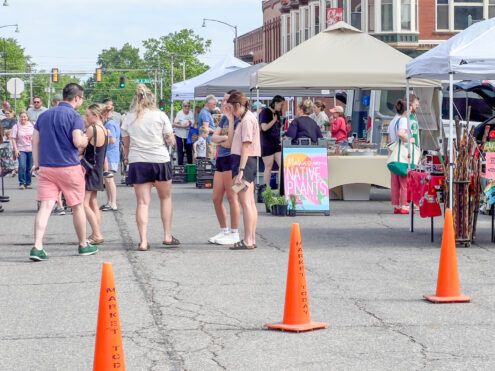 Shoppers browse vendor booths during the opening weekend of the Oskaloosa Farmers Market on the downtown square Saturday morning. The market features locally grown produce, baked goods, handmade crafts, plants and other homemade items from area vendors throughout the summer season.
