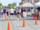 Shoppers browse vendor booths during the opening weekend of the Oskaloosa Farmers Market on the downtown square Saturday morning. The market features locally grown produce, baked goods, handmade crafts, plants and other homemade items from area vendors throughout the summer season.