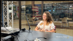 Aleksandra Nagorna speaks during an interview with Oskaloosa News inside the Oskaloosa News studio. The Oskaloosa High School graduate has built a career as a composer, musician, educator, and film scorer, recently earning recognition for her work on the award-winning film "Jury of Her Peers." Nagorna discussed her journey from growing up in Oskaloosa to composing music for films, theater productions, and orchestras across Iowa.