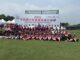 Youth softball players from Iowa and China gather for a group photo during the 2025 China-USA Youth Softball Exchange in Shanghai, China. The 2025 event marked the beginning of the Musco Youth Sports Exchange program. Photo courtesy of Musco.