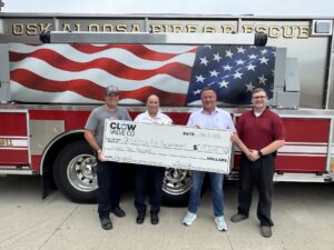 Pictured from left are Dustin Hook, Oskaloosa Fire Chief Scott Vaughan, Clow Valve Co. Vice President and General Manager Mark Willett, and Clow Valve Co. Machine Tech Specialist Austin Glandon. Clow Valve’s donation of $25,000 will help the Oskaloosa Fire Department replace aging fire hoses, improving firefighter safety and helping ensure crews have reliable equipment ready for the next emergency.