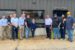 U.S. Rep. Mariannette Miller-Meeks, center, and Clow Valve Vice President and General Manager Mark Willett, standing to the right of the plaque, join Clow Valve team members outside the company’s Metal Casting Facility during Miller-Meeks’ Aug. 6, 2026, visit to Oskaloosa.